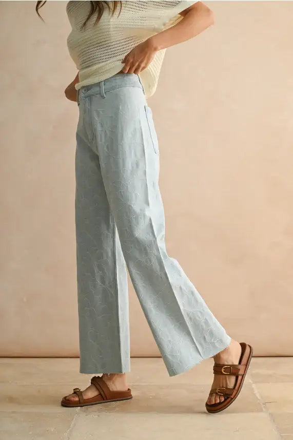 Light blue stitch pattern denim pants showcasing women’s boho chic clothing style