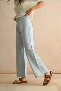 Light blue stitch pattern denim pants showcasing women’s boho chic clothing style