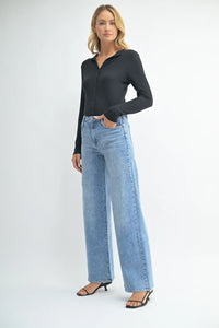 Light blue wide leg denim jeans from Shop Daisy, featuring a straight cut silhouette