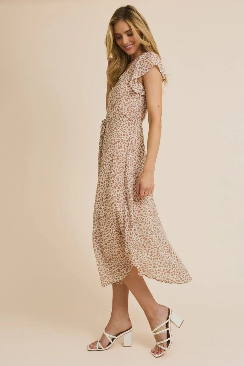 Light-colored animal print midi dress with ruffle sleeves, perfect for elegant occasions