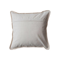 Light gray decorative throw pillow with contrasting piping for a boho chic look