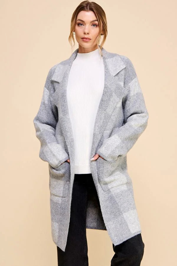 Light gray oversized Eazy Cozy Plaid Lapel Cardigan over white sweater and dark pants