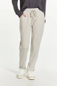 Light gray Thread and Supply Harla pants with elastic waistband and white sneakers