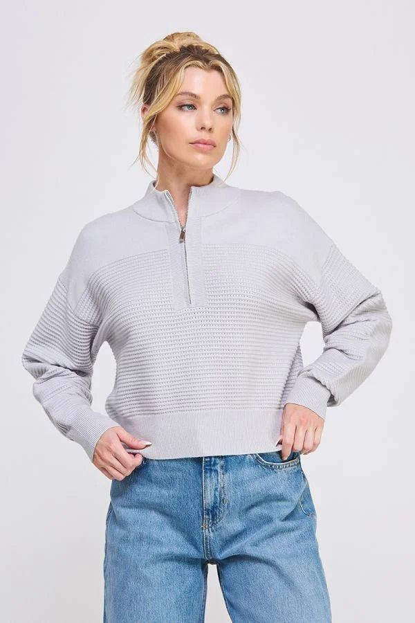 Light gray waffle-textured fine gauge dolman half zip sweater with mock neck