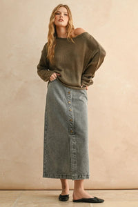 Light weight olive green knit sweater with long sleeves paired with faded denim maxi skirt