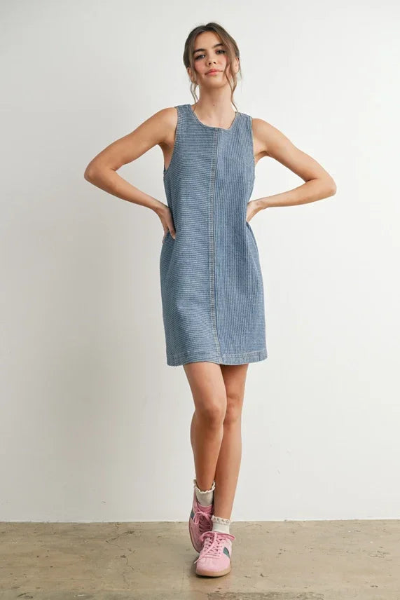 Light wash denim mini dress displayed as DENIM MINI DRESS, perfect for casual wear