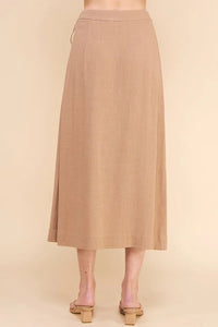 Long beige flowy midi skirt with a simple design for a boho-chic look