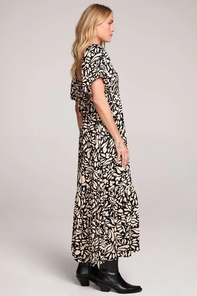 Evra Maxi Rayon Ruffle Dress with black and white pattern, short sleeves, and black boots