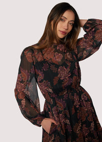 Bohemia maxi dress with floral print, long sleeves, cinched waist, dark background