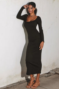 Long-sleeved black ribbed knit square neck midi dress with a sleek bodycon fit