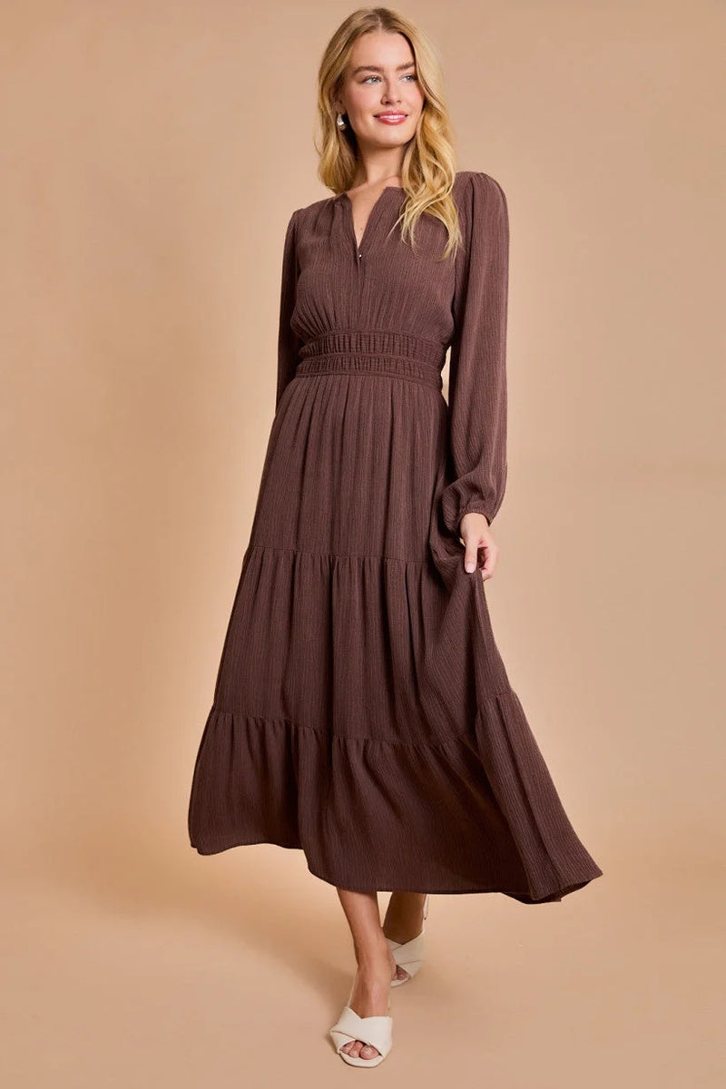 Long-sleeved brown maxi dress with tiered skirt, perfect for women’s boho chic clothing