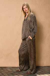 Matching long-sleeved shirt and wide-leg sand pull drawstring pants set in dark brown and beige pattern