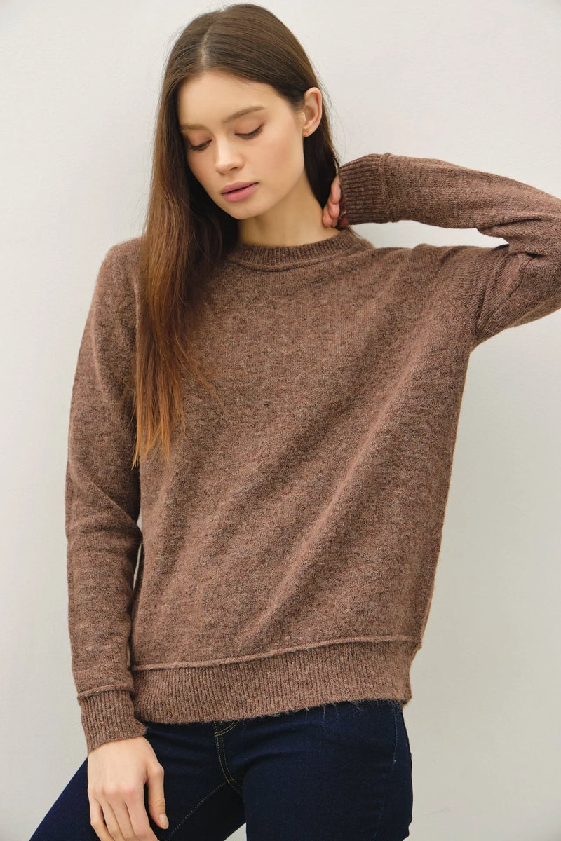 Brown long-sleeved crew neck pullover with exposed seam for a stylish look