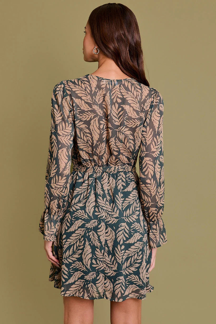 Long Sleeve Surplice Abstract Dress featuring a leaf print pattern in muted colors