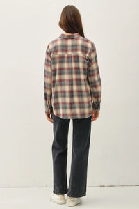 Classic cotton plaid shirt in earthy tones paired with jeans and white sneakers
