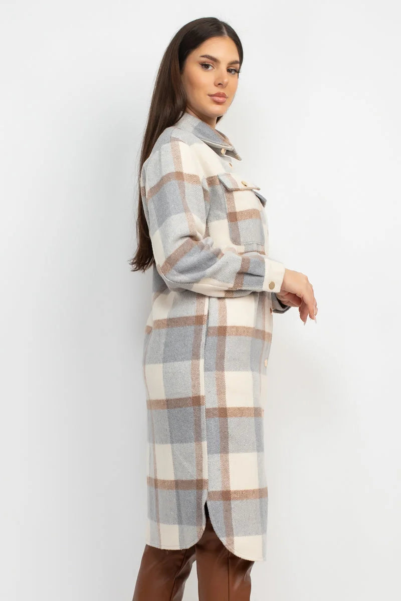 Long-sleeved plaid shirt dress in muted gray, beige and brown tones.