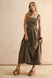 Olive green sleeveless square-neck dress with pleated skirt from STITCH FRONT PLEATED DETAIL DRESS, perfect for women’s boho chic clothing at Shop Daisy