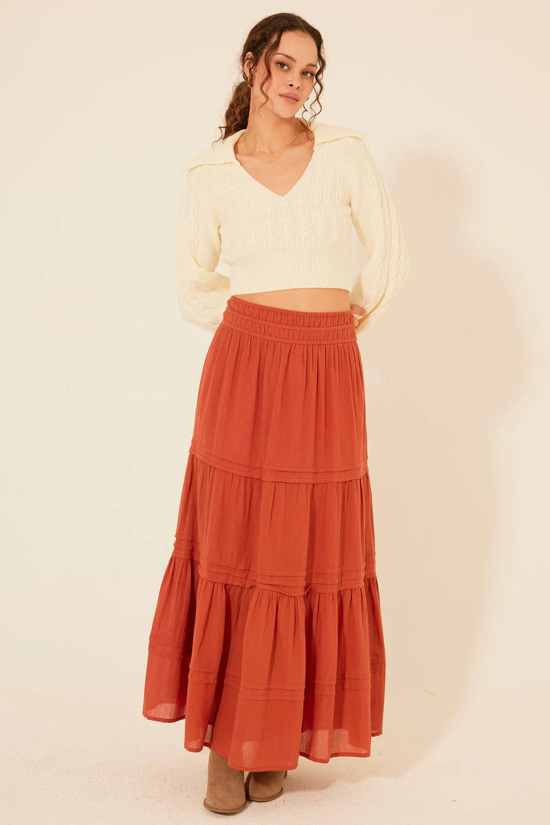 Long, tiered rust-colored Zella Maxi Skirt with an elastic waistband for stylish comfort