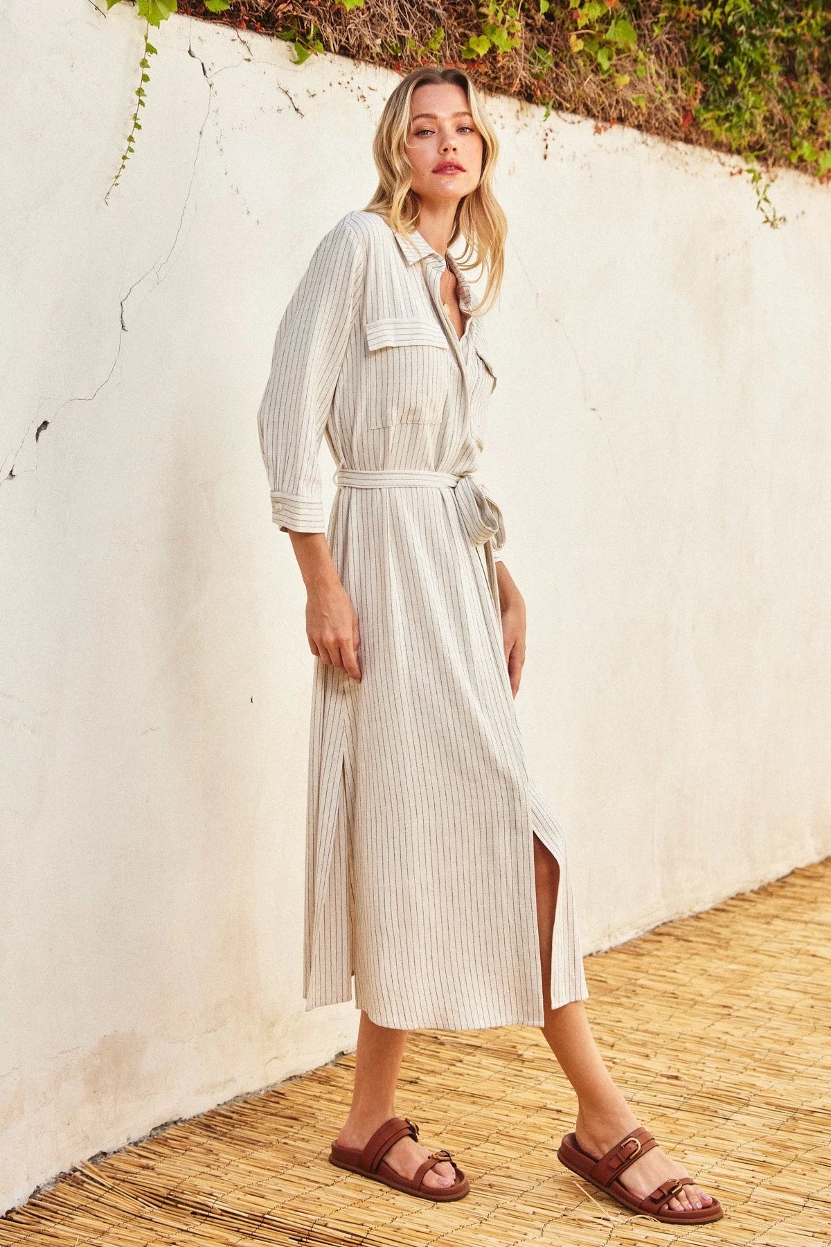 Long white maxi shirt dress with vertical stripes and belted waist for elegant style