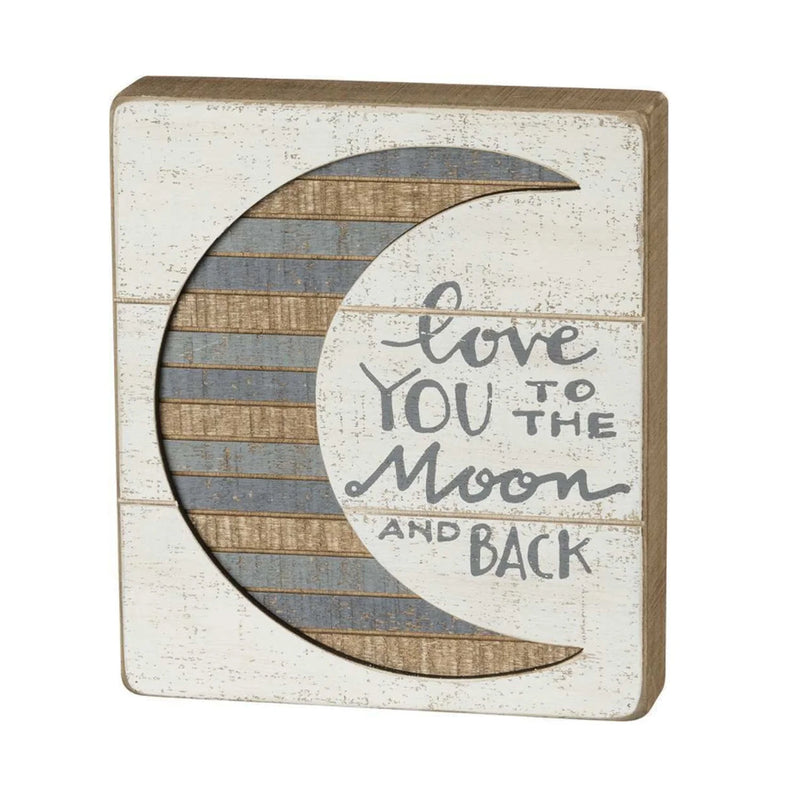 Love You to the Moon and Back box sign displayed in a boho decor setting