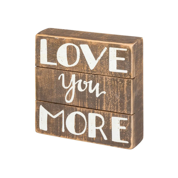 Love You More wooden block displayed in a decorative slat box sign for home decor