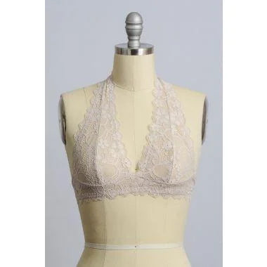 Mannequin showcasing Lined Lace Halter Top Bralette with white bra and beige skirt