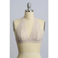 Mannequin showcasing Lined Lace Halter Top Bralette with white bra and beige skirt