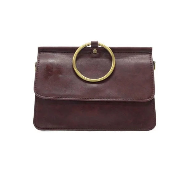 Maroon leather ARIA RING BAG with gold ring handle showing widest point and interior zip