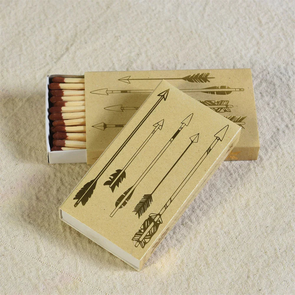 Matchboxes featuring a gold arrow pattern, part of the Gold Arrows Matches Box collection