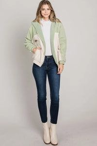 Mint green Soft Brushed Matte Woven Hoodie Jacket with cream pockets over white top and jeans