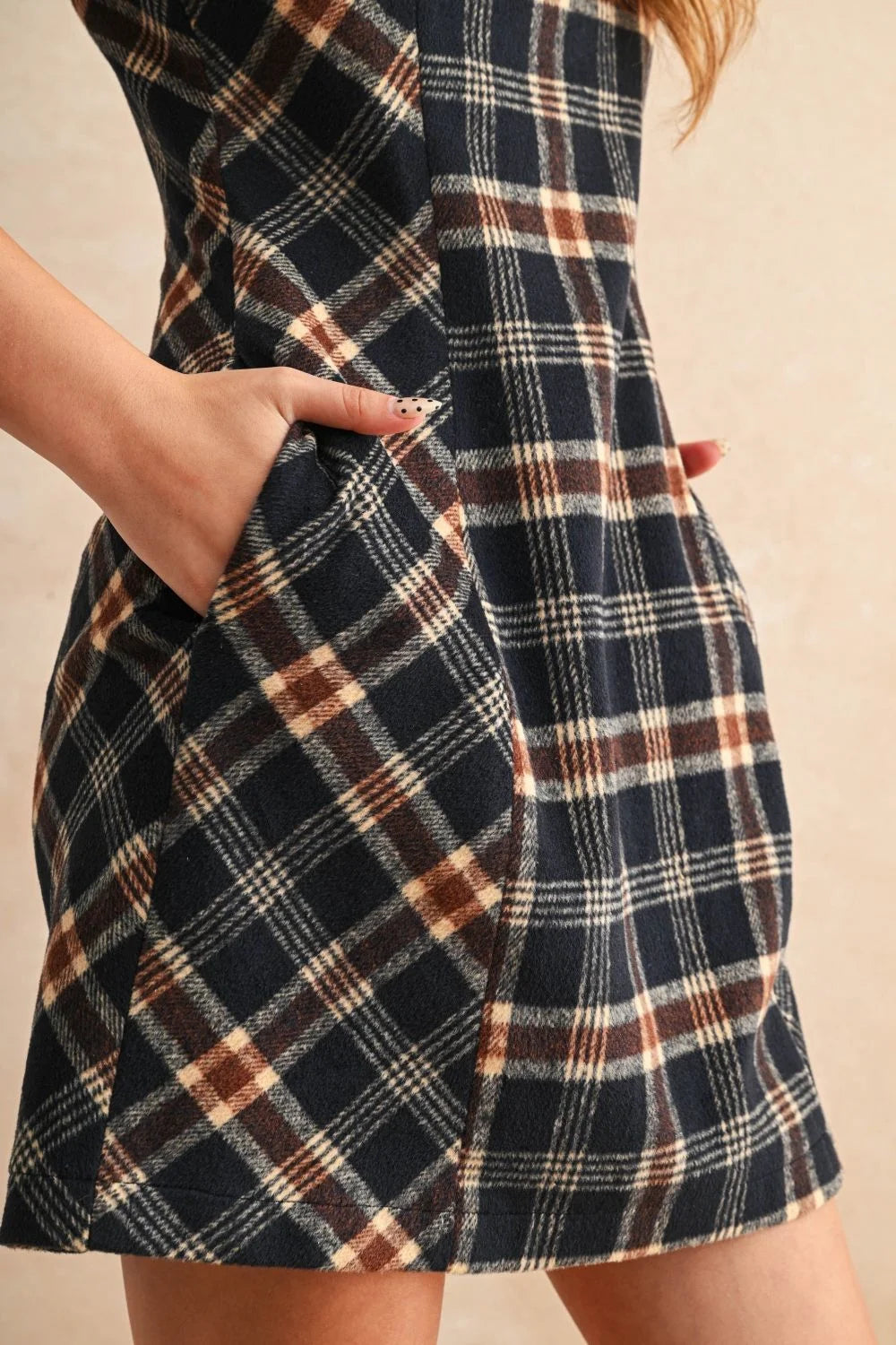 Navy blue, brown, and cream plaid pattern mini dress with pockets, ideal for casual wear