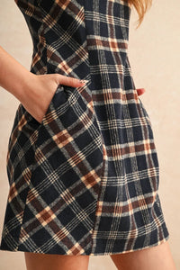 Navy blue, brown, and cream plaid pattern mini dress with pockets, ideal for casual wear