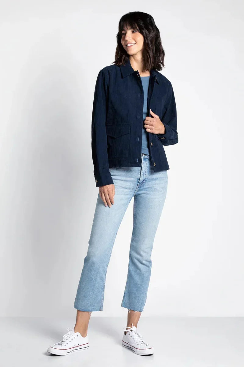 Thread and Supply Hughes Jacket in navy blue cotton with white Converse sneakers and light wash jeans