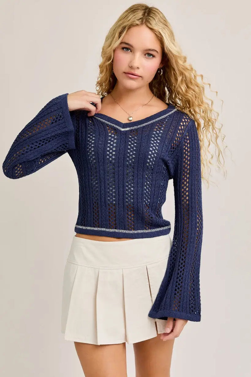 Navy blue knit top with bell sleeves featuring crochet contrast stitch design