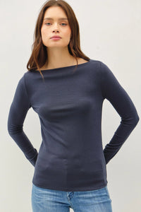 Navy blue long sleeve basic boat neck top paired with blue jeans for a stylish look