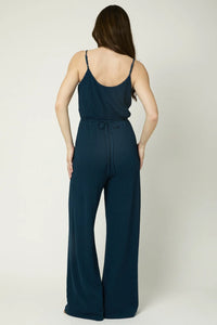 Navy blue sleeveless jumpsuit with wide-leg pants for a boho-inspired free spirit style