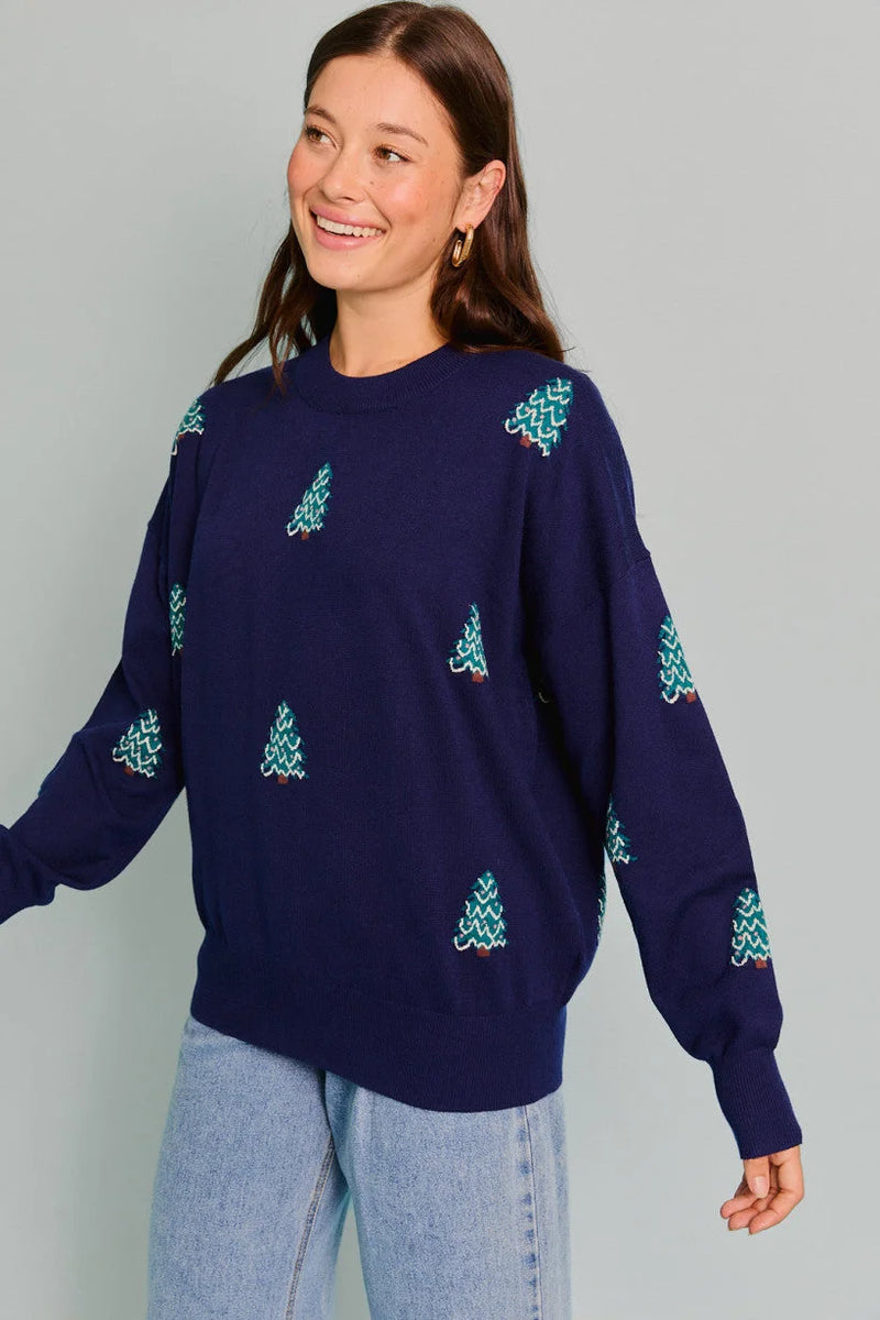 Navy blue sweater with light blue Christmas tree patterns from Shop Daisy women’s boho clothes