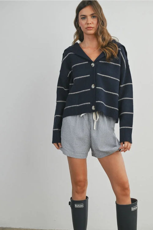 Navy blue and white striped collared cardigan with button closure