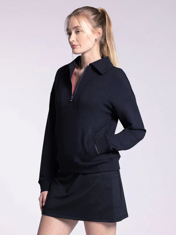 Navy blue Monarch Pullover Sweatshirt with collar worn over a dark skirt