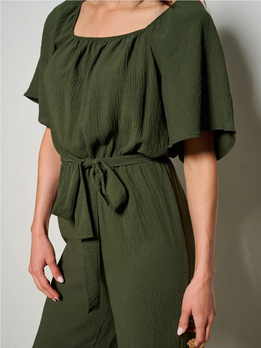 Olive green boho dress with flutter sleeves and tie waist for a free spirit look