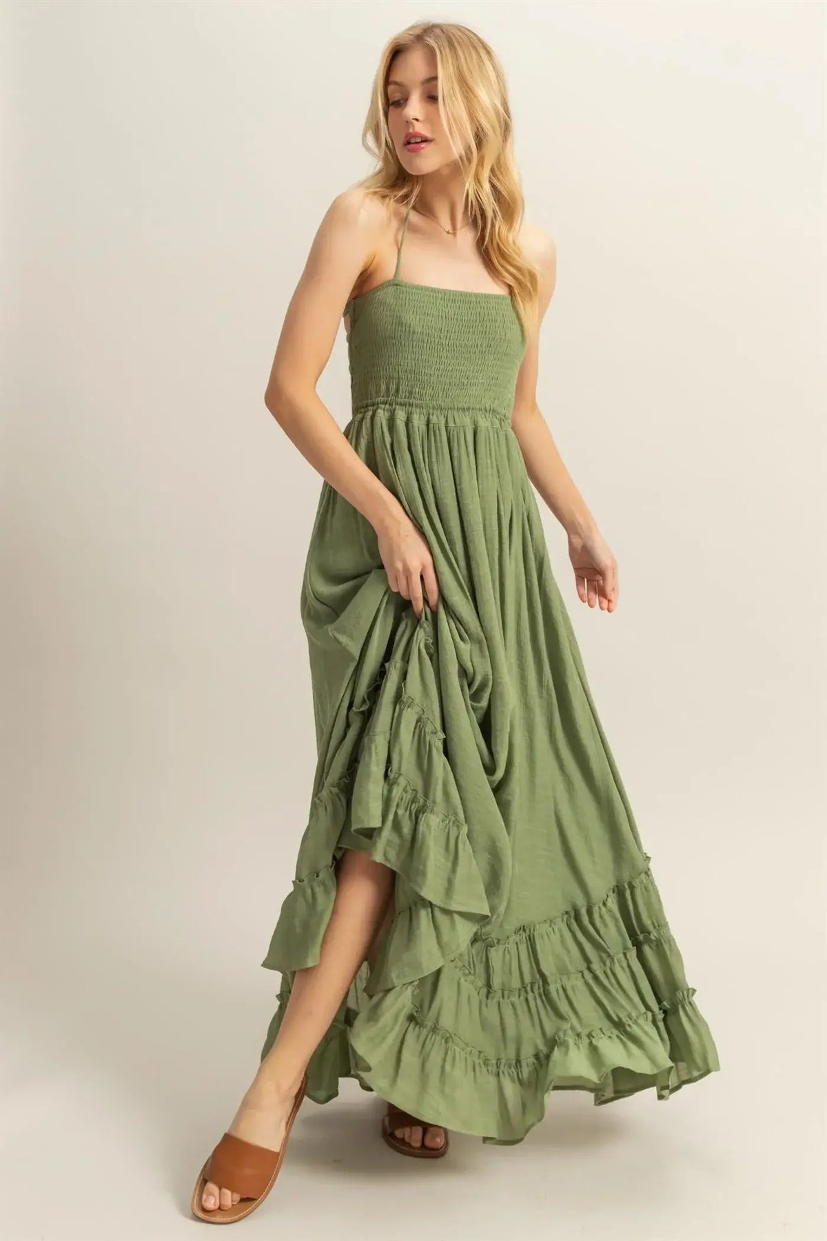 Olive green maxi dress with smocked bodice and tiered hem for elegant style