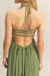 Olive green open-back maxi dress with smocked bodice and tiered hem design