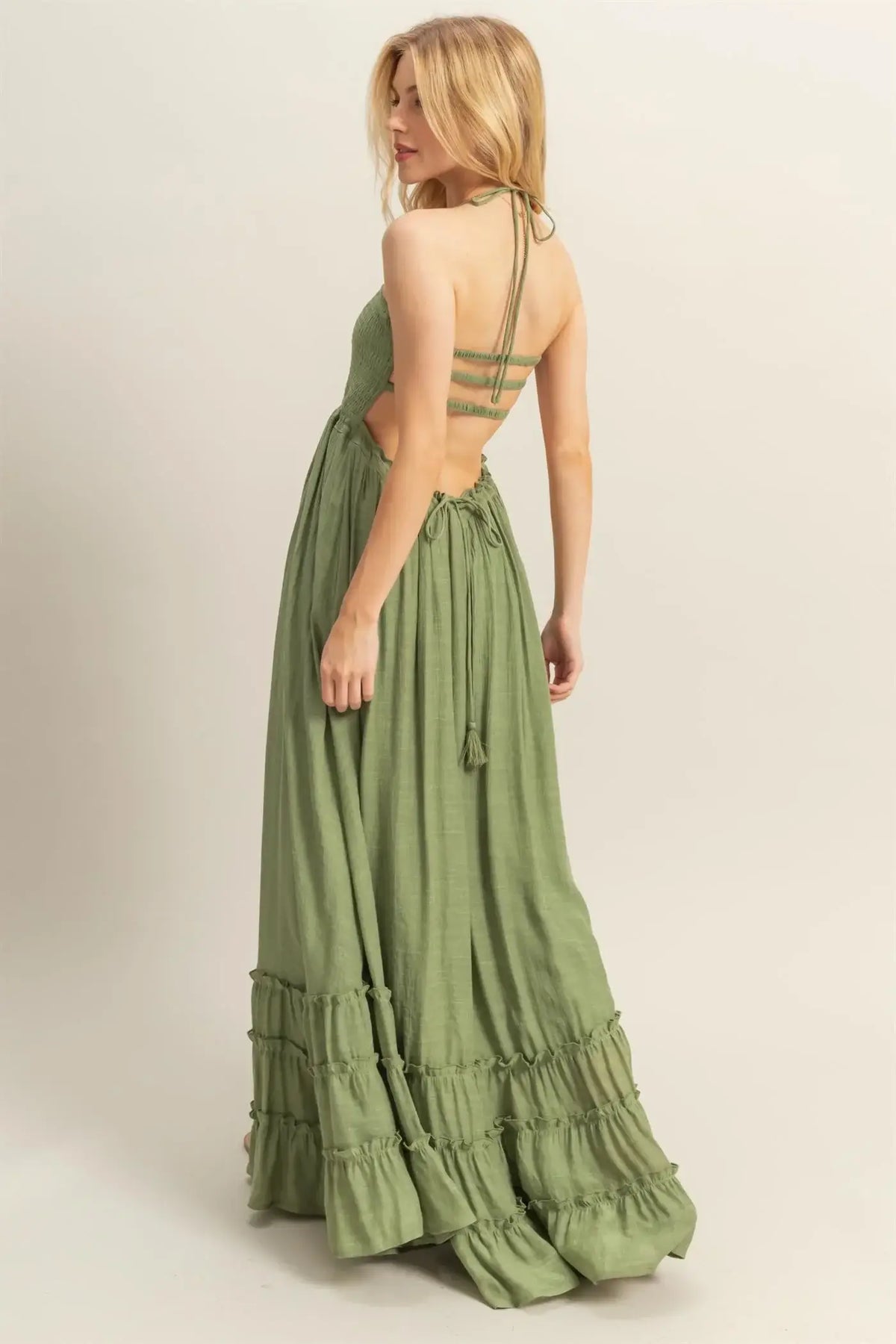 Olive green open-back maxi dress with smocked bodice and tiered hem