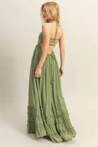 Olive green open-back maxi dress with smocked bodice and tiered hem