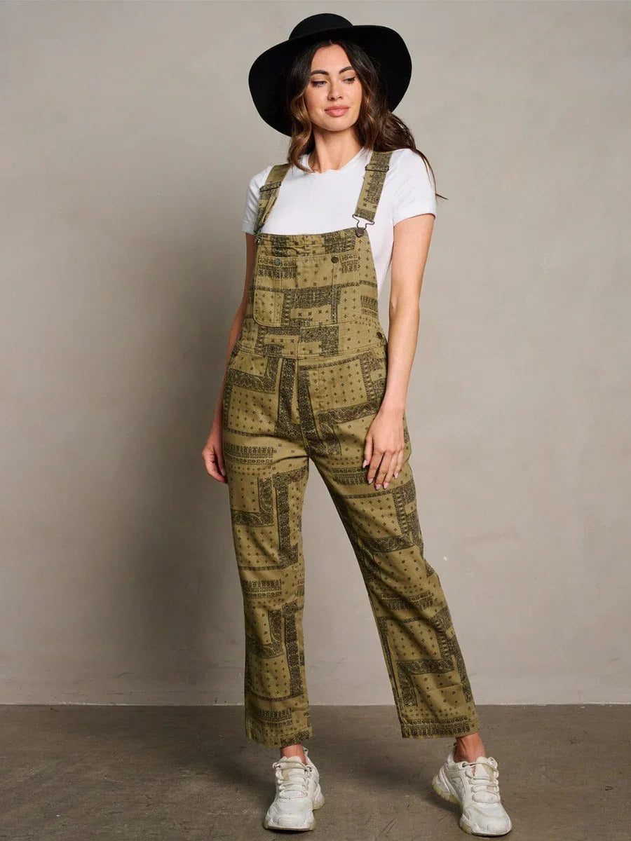 Olive green patterned overalls over a white t-shirt, ideal for women’s boho chic clothing