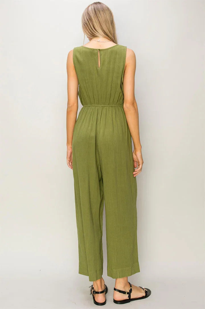 Olive green sleeveless linen jumpsuit with wide-leg pants for a flowy boho style