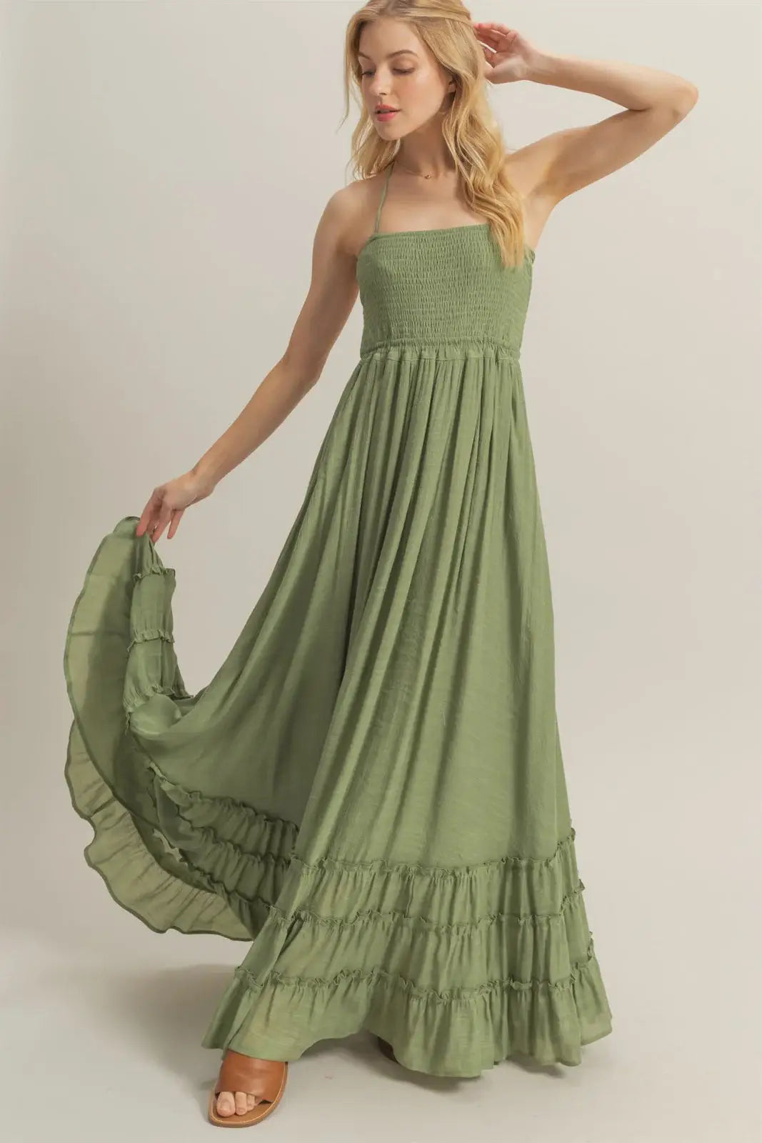 Olive green strapless maxi dress with smocked bodice and tiered hem for elegant style