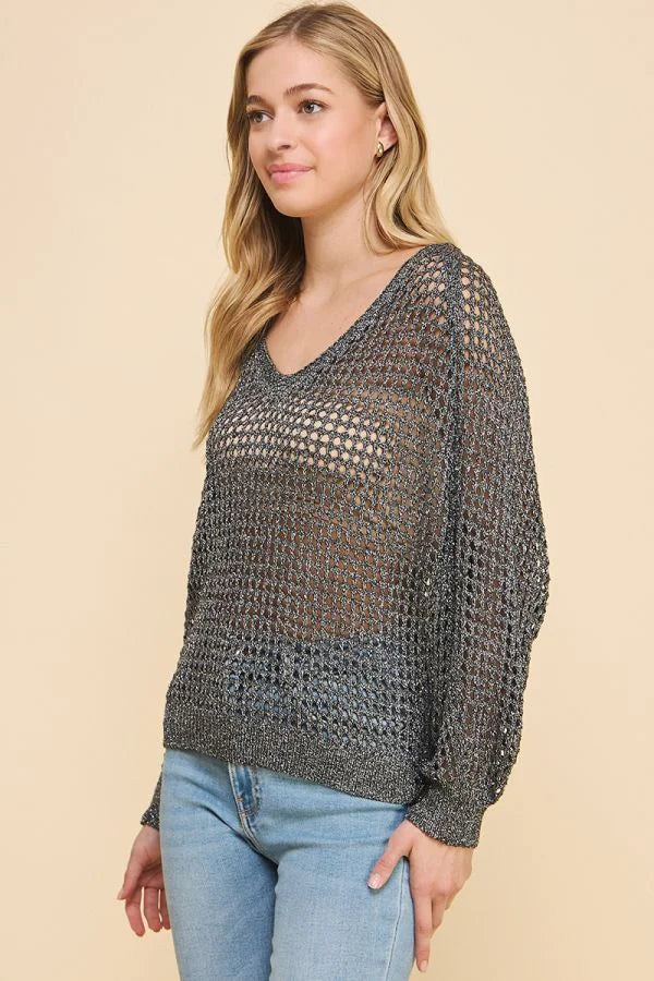 Open-knit gray sweater featuring a loose fit and long sleeve open weave design