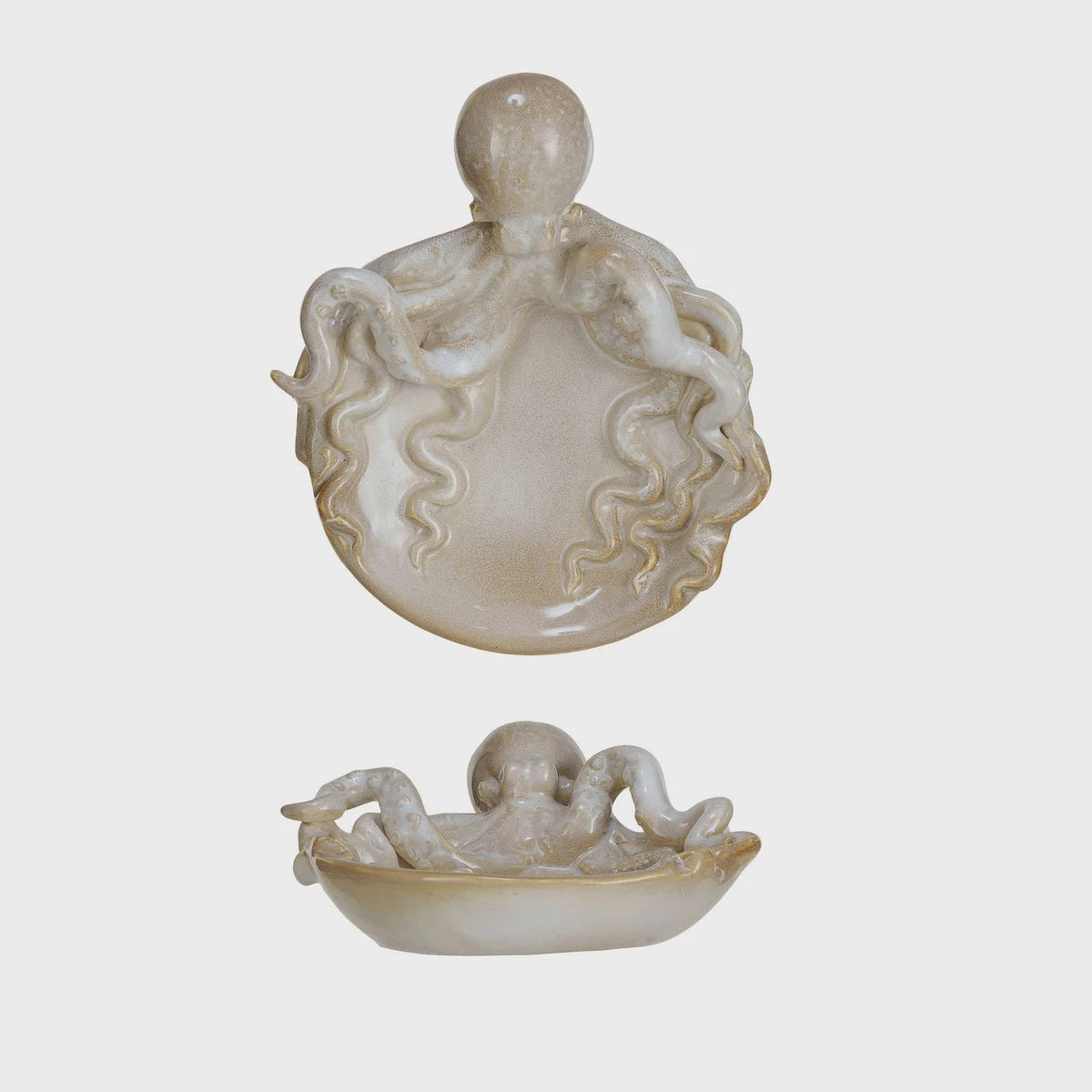 Chinese ivory figs displayed on a Stoneware Octopus Dish