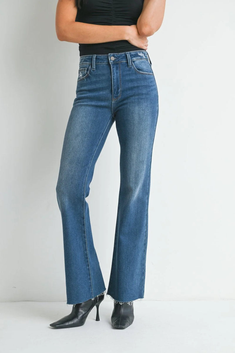 Pair of medium rise waist flare denim jeans in a stylish medium wash